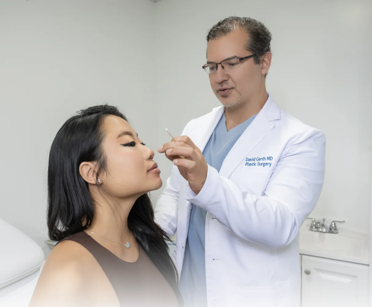 Dr. David Gerth, triple board-certified plastic surgeon, with a patient